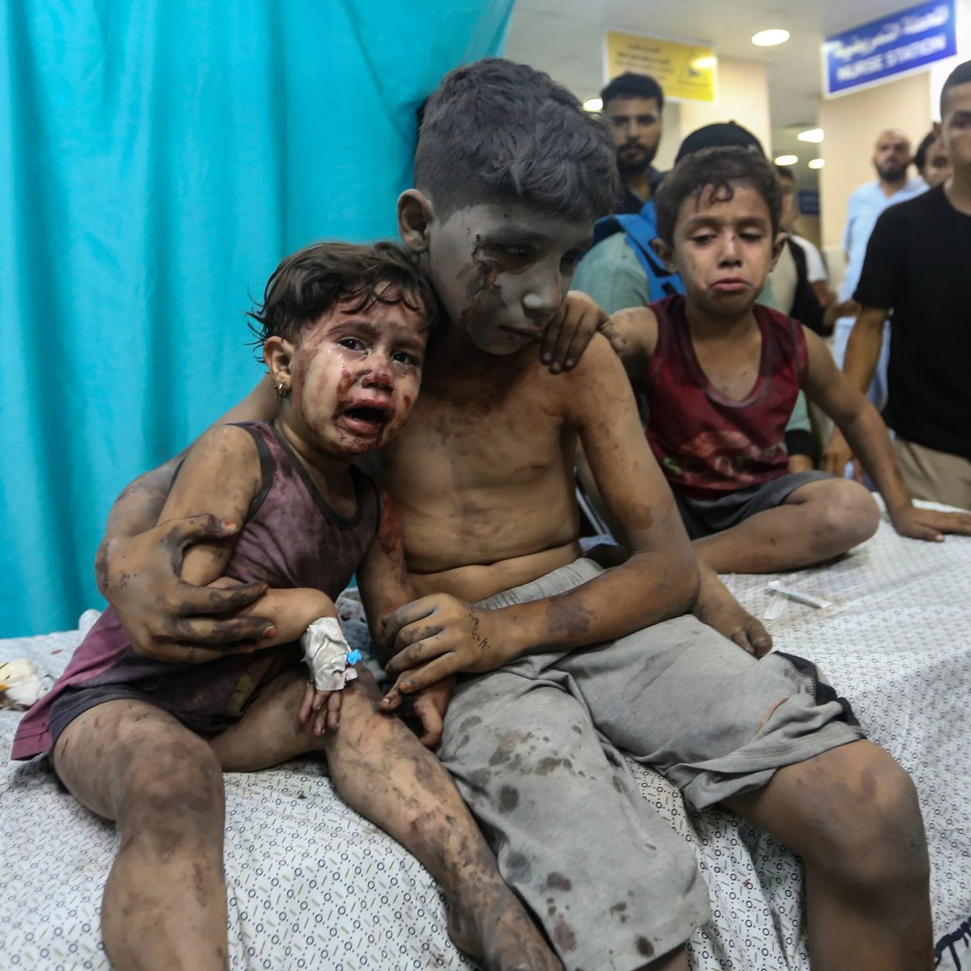 Injured Palestinian children sitting together in a Gaza hospital